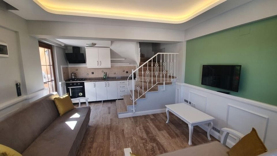 Family Duplex, 1 Bedroom | Living area | 32-inch LED TV with satellite channels