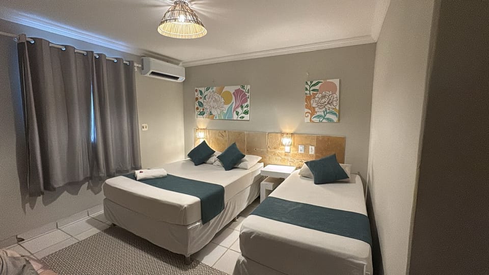 Grand Triple Room | Minibar, individually furnished, blackout drapes, free WiFi