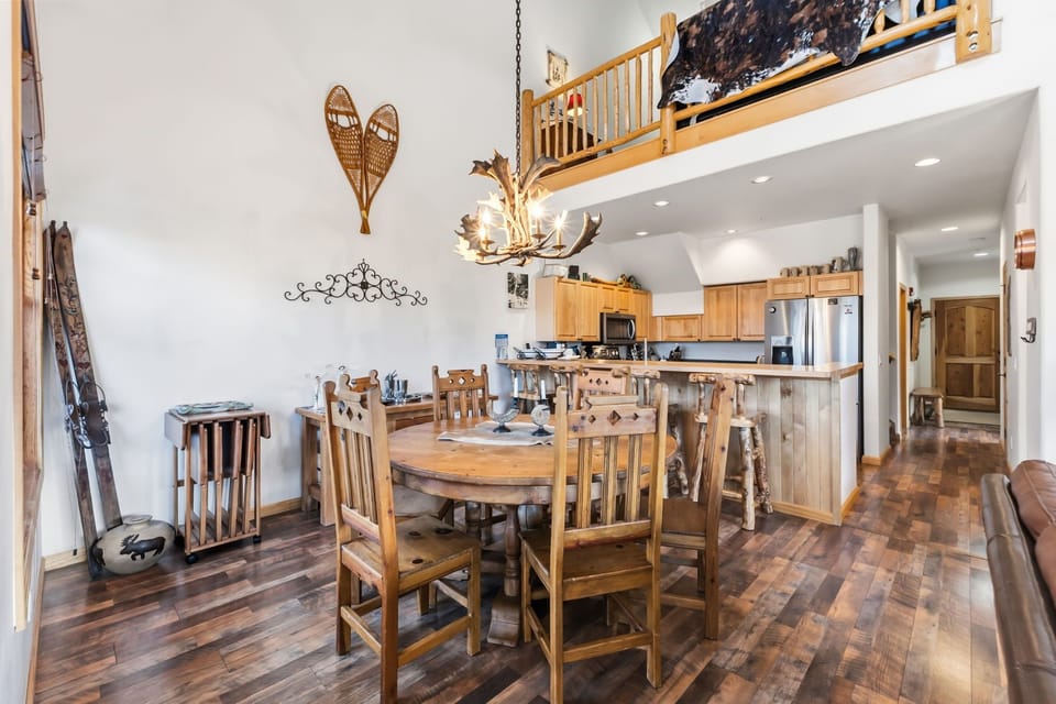 Your mountain retreat features an open-concept design with rustic charm, complete kitchen, and cozy loft space above.