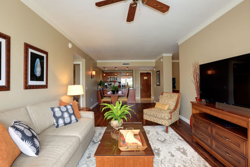 Living room, dining room and kitchen in this beach resort suite