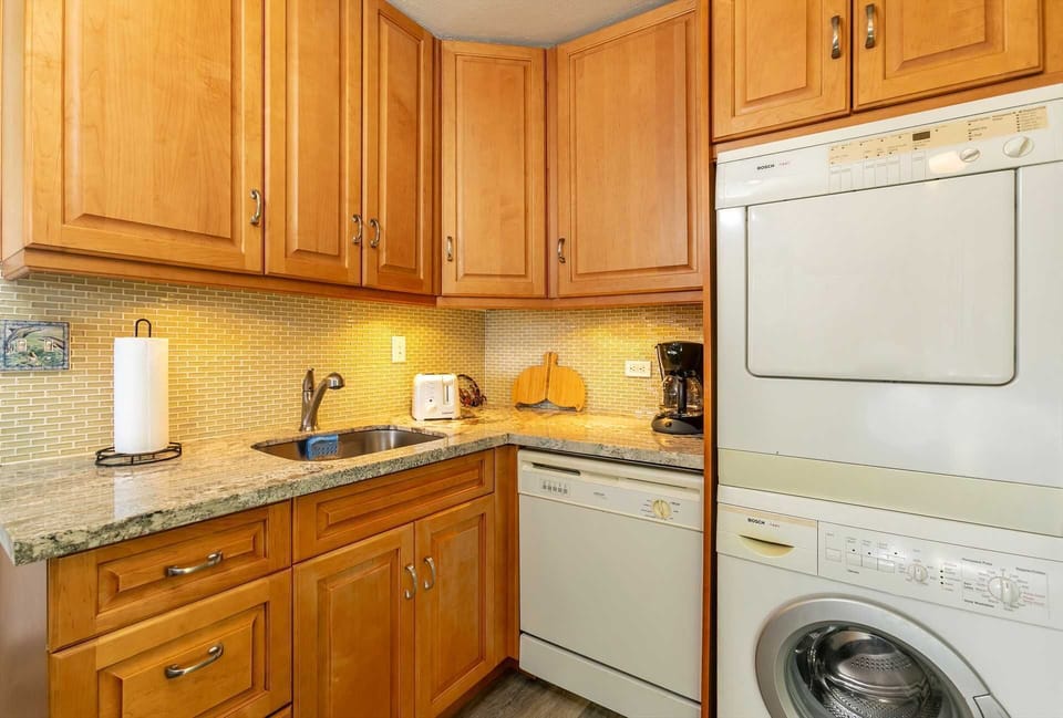 Full kitchen with private washer and dryer.