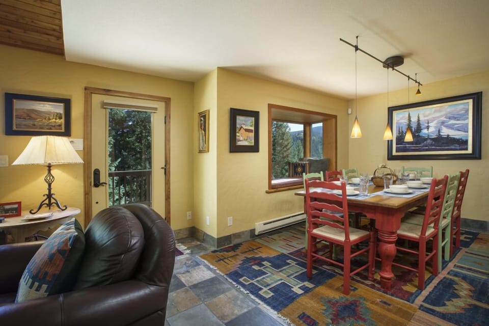View into the 8-person dining area with reading alcove and balcony access
