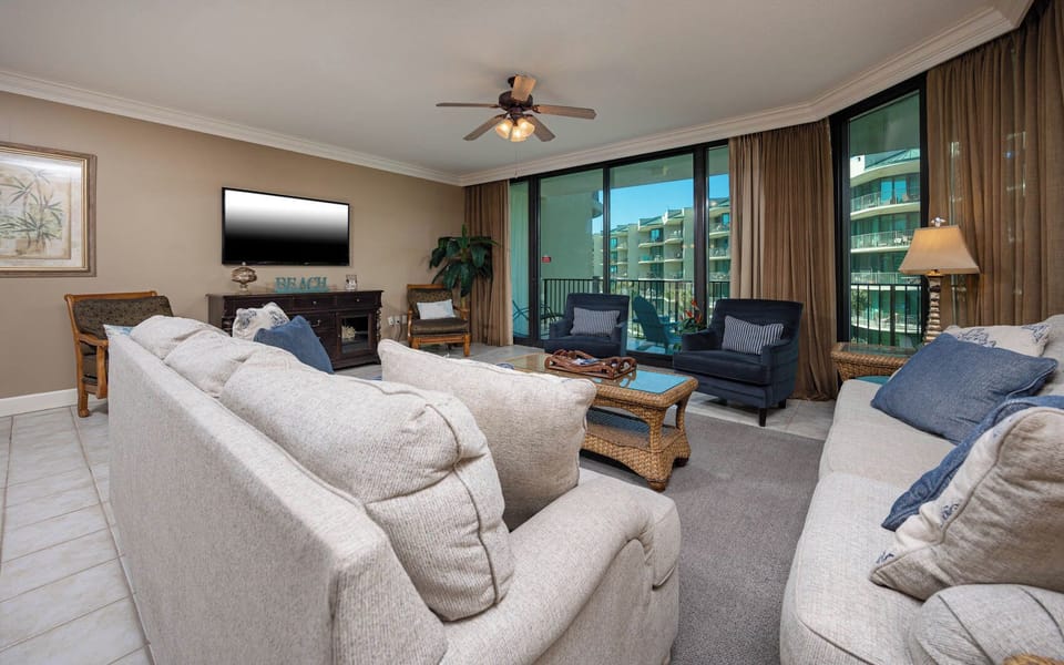 Relax on the cozy sofa with a queen sleeper in this inviting family room with beautiful balcony views