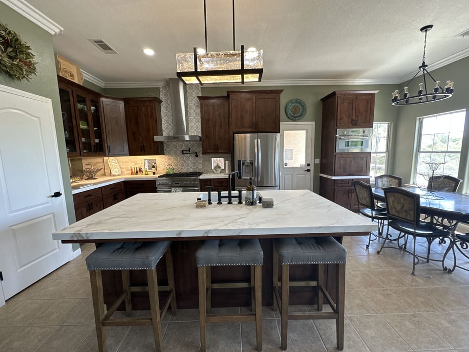 Remodeled kitchen w/porcelain countertops, Thermador appliances, new tiled walls