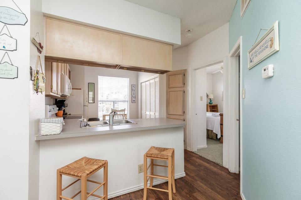 Your fully-equipped kitchen makes morning coffee and evening meals a breeze, with bar seating perfect for casual dining.