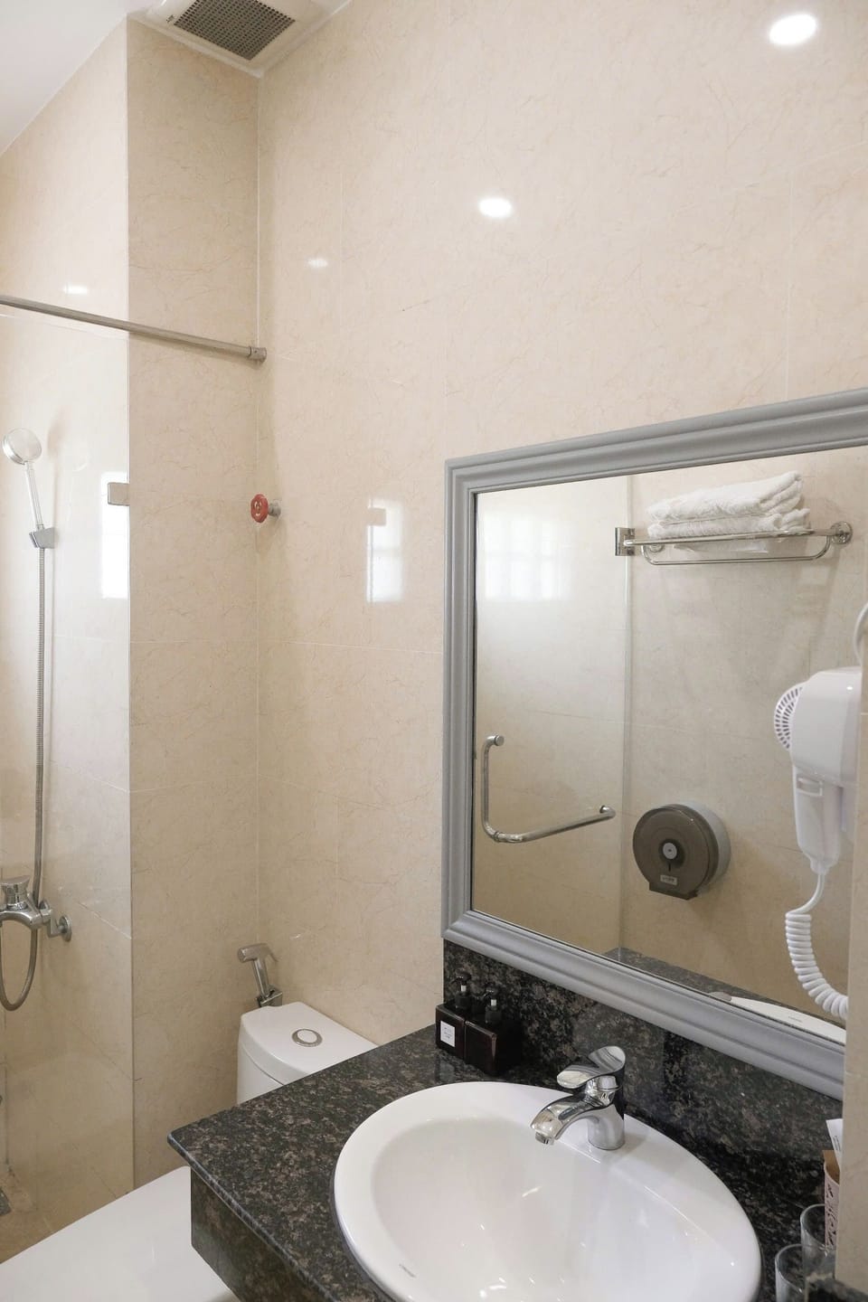 Shower, free toiletries, hair dryer, slippers