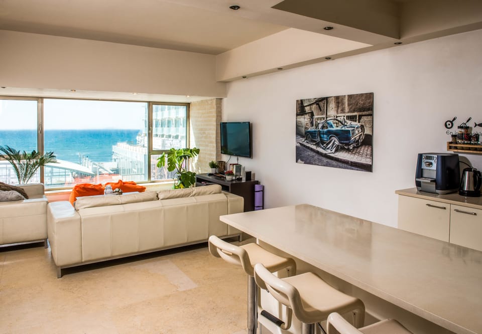 Deluxe Apartment, Multiple Beds, Non Smoking | Living room | Flat-screen TV