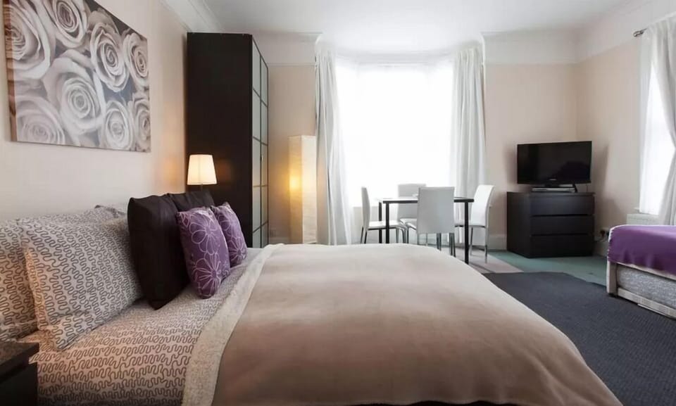 Family Room, Shared Bathroom | Iron/ironing board, free WiFi, bed sheets