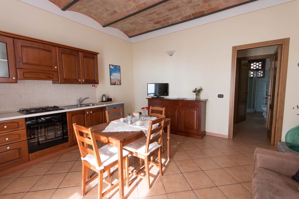 Apartment, 1 Bedroom (Le Volticine) | Private kitchen | Full-size fridge, oven, stovetop, dishwasher