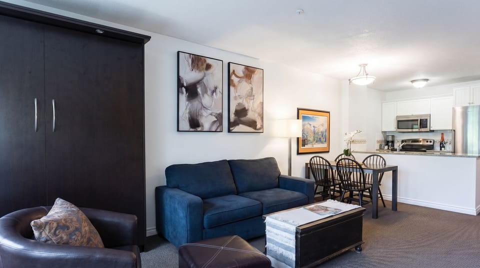 Living room and kitchen, dining table is expandable to seat up to six people 