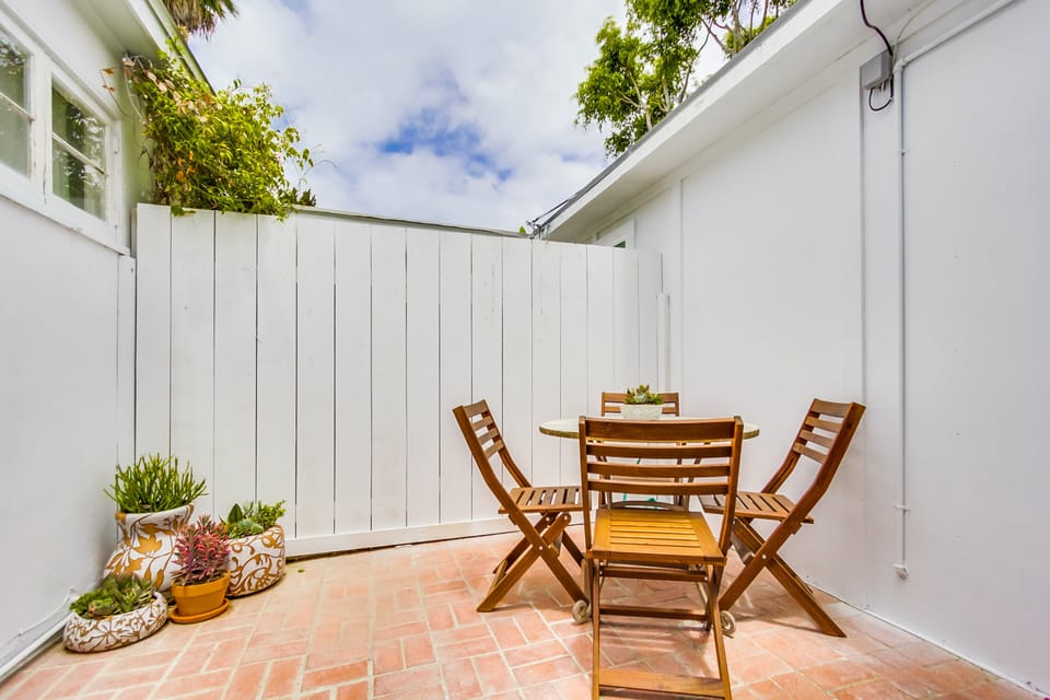 Private patio with BBQ and shade sails.