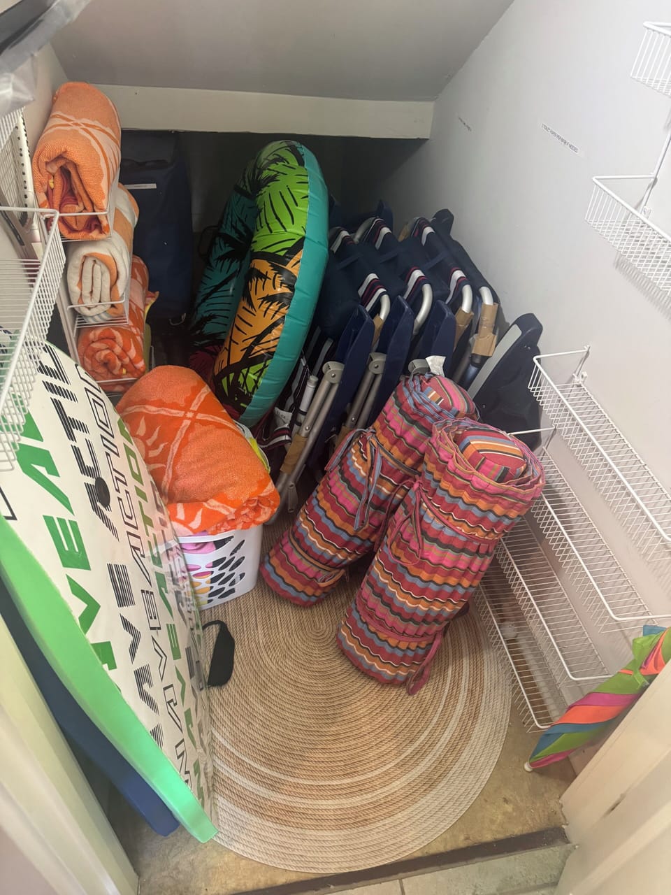 Beach closet- beach towels, chairs, cart,boogie boards, etc..