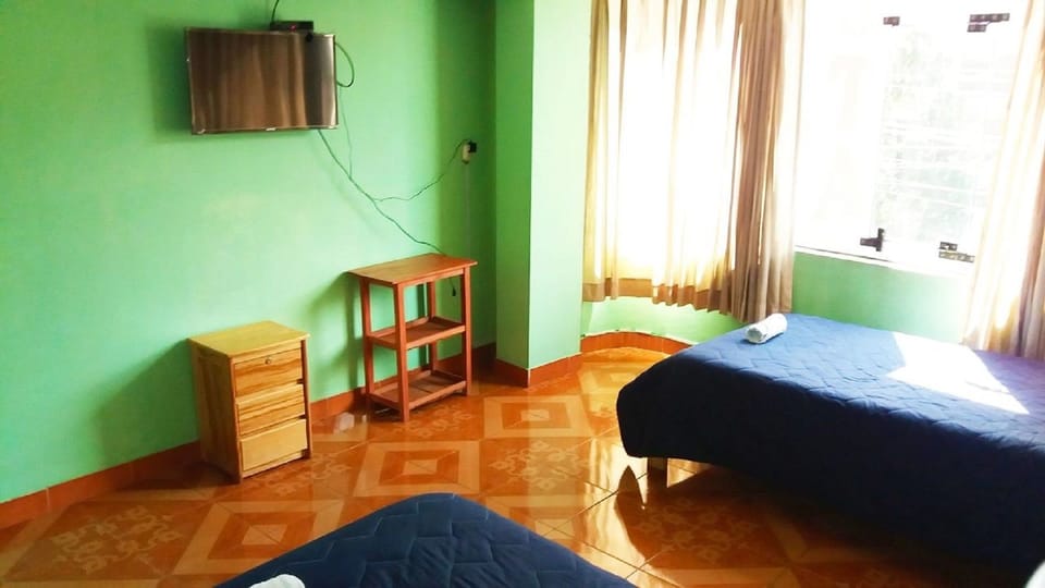 Family Room | Down comforters, individually decorated, desk, iron/ironing board