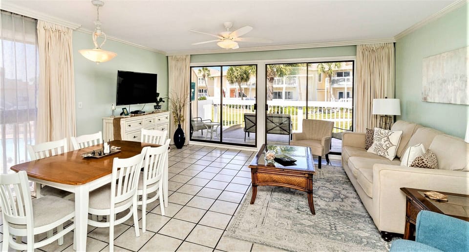 Bright living room with windows on three sides.