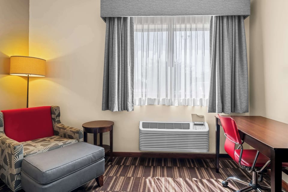 Desk, laptop workspace, iron/ironing board, free cribs/infant beds