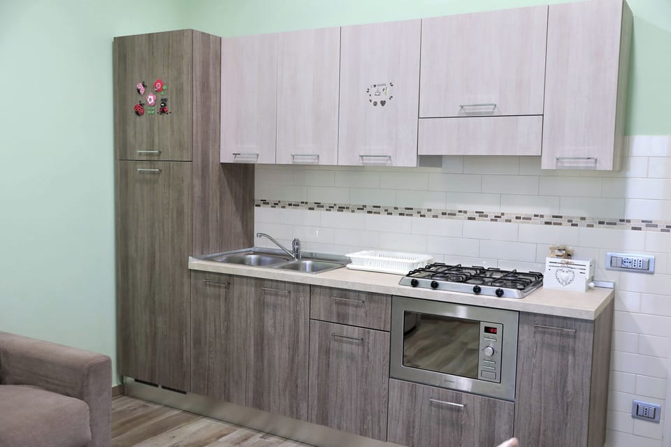 Family Apartment, 2 Bedrooms, Garden View, Garden Area (APOLLO) | Private kitchenette | Full-size fridge, cleaning supplies, paper towels