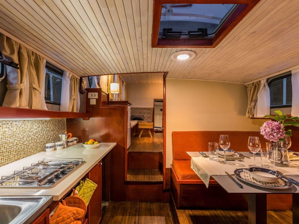 Table, Furniture, Cabinetry, Countertop, Wood, Interior Design, Lighting, Kitchen, Plant, Kitchen Appliance