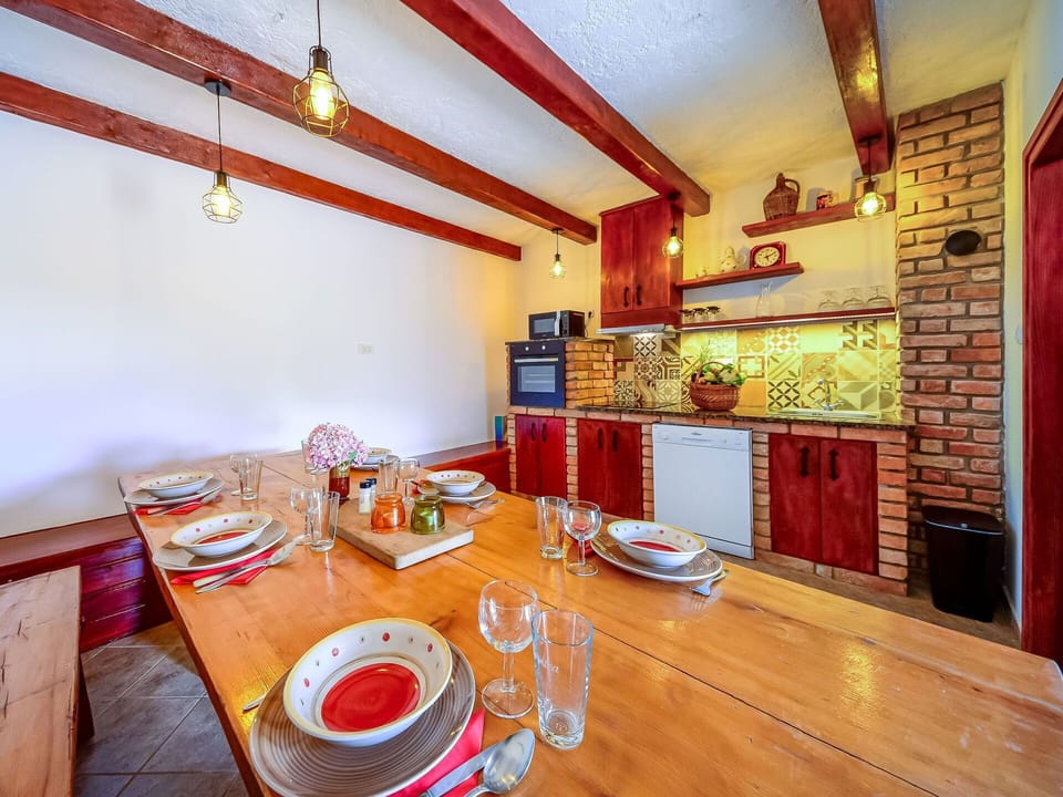 Furniture, Property, Cabinetry, Table, Building, Wood, Orange, Interior Design, Tableware, Floor