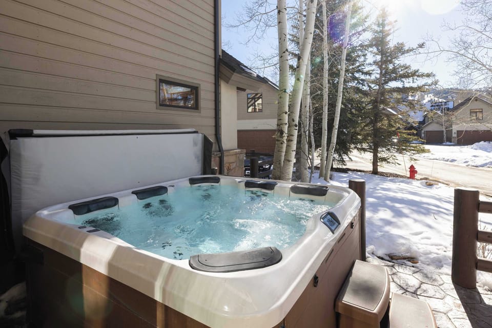 Enjoy a soak in the private hot tub on your deck after a day on the slopes