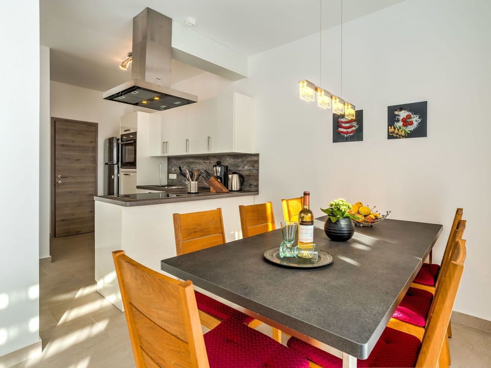 Room, Property, Dining Room, Furniture, Interior Design, Yellow, Table, Countertop, Building, House