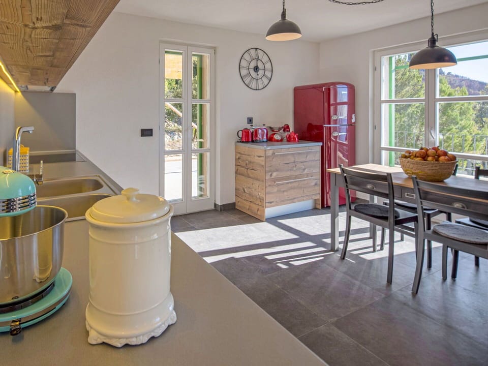 Property, Window, Interior Design, Lighting, Yellow, Floor, Flooring, Houseplant, Wood, Kitchen