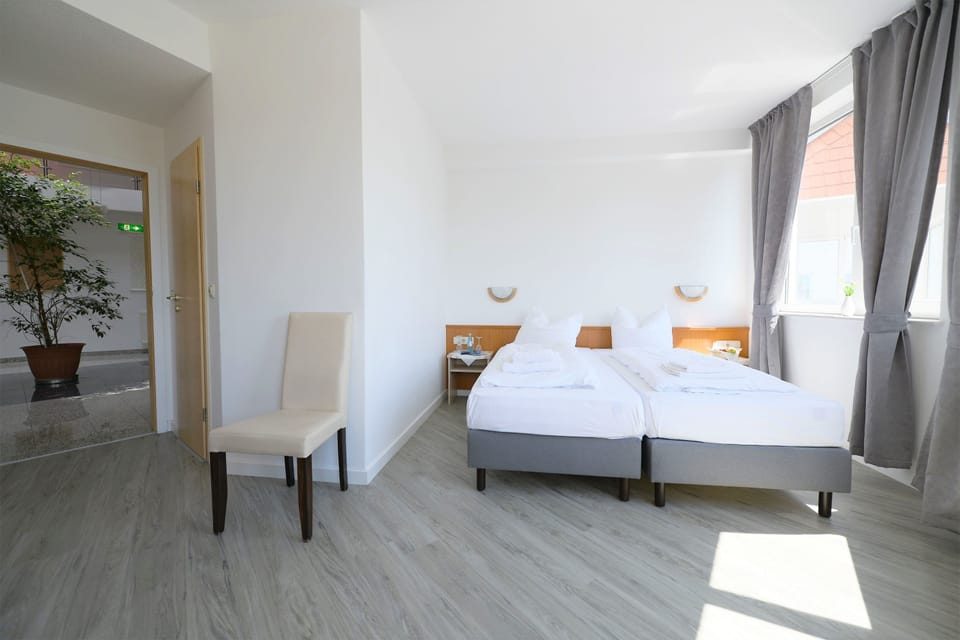 Premium bedding, desk, blackout drapes, iron/ironing board