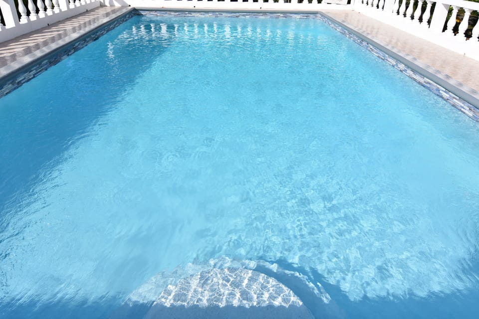 Swimming pool with BBQ on the left