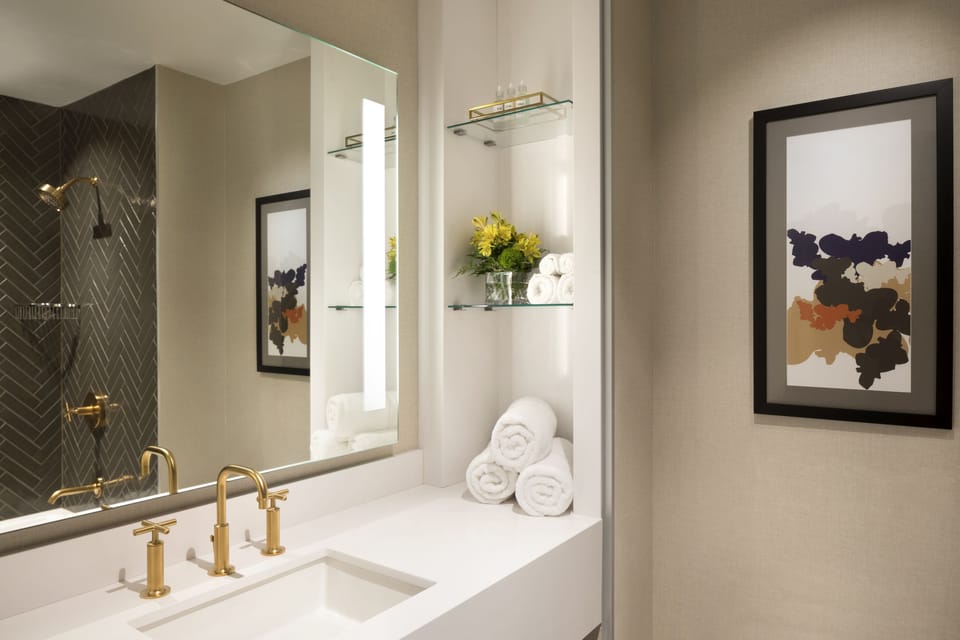 Rainfall showerhead, designer toiletries, hair dryer, towels