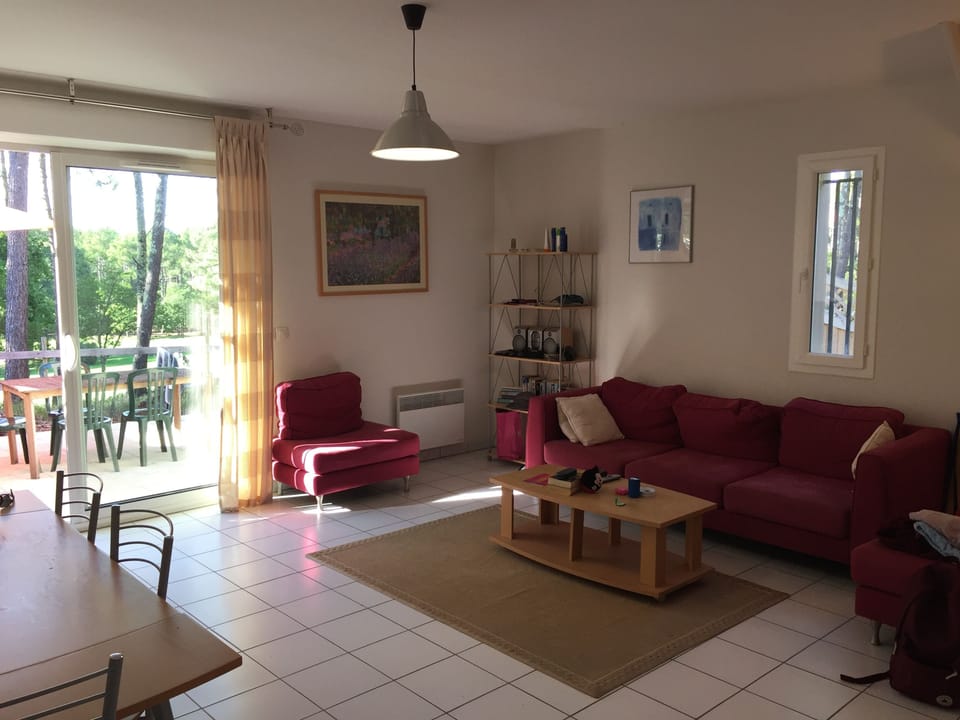 The lounge linked to the dining area with access to terrace.