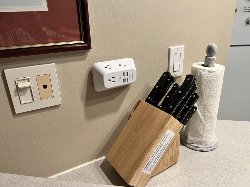 Charger outlets in kitchen, living room, bedroom & by your office desk