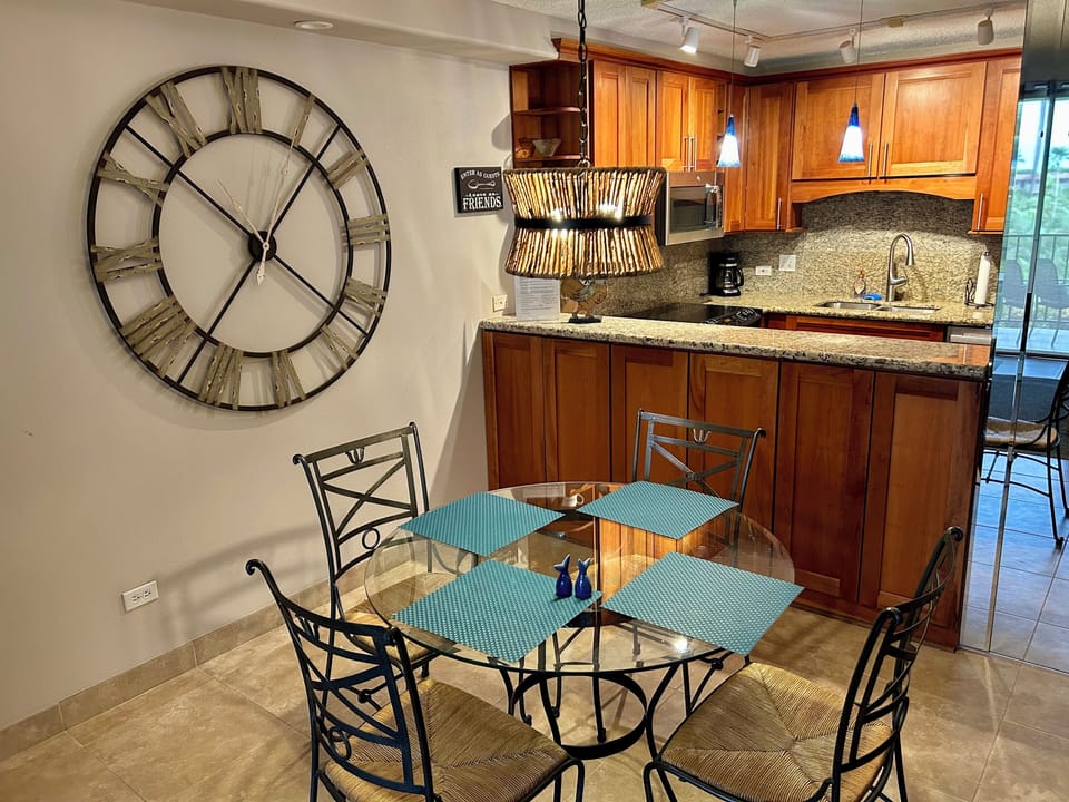 Remodeled kitchen with Cherry Wood Cabinets and Granite Counters