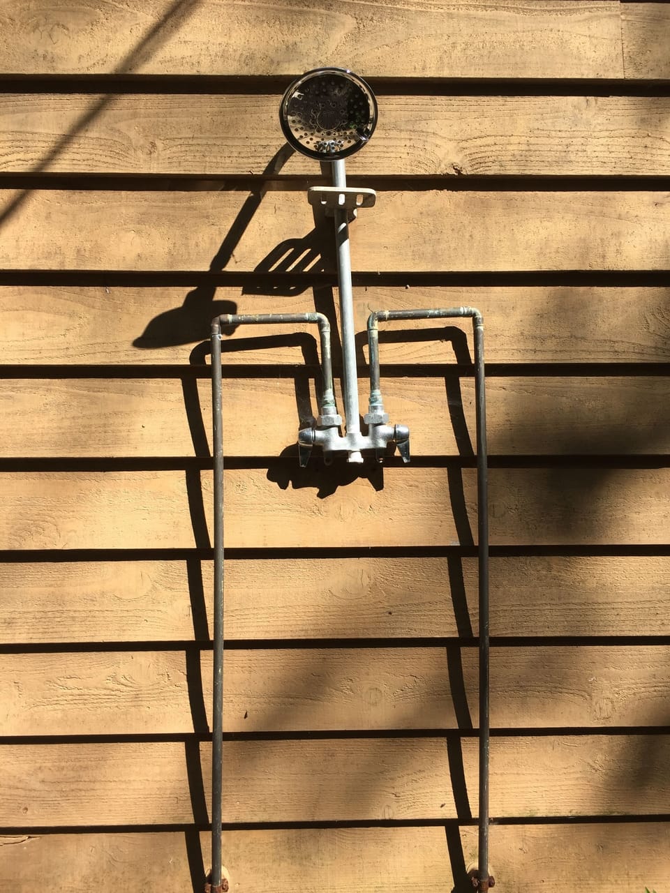 An outdoor shower to clean off after sand volleyball or a day in the river.