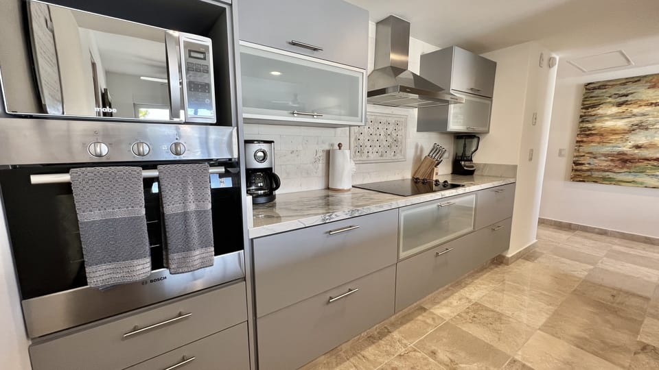 Plenty of kitchen cabinet space with all pots, pans, plates & cups provided