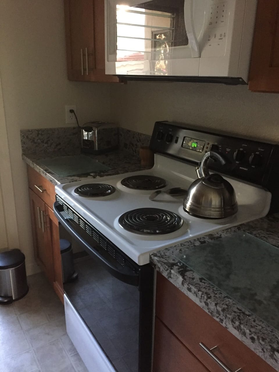 Granite, cabinets, & good quality, clean microwave. 