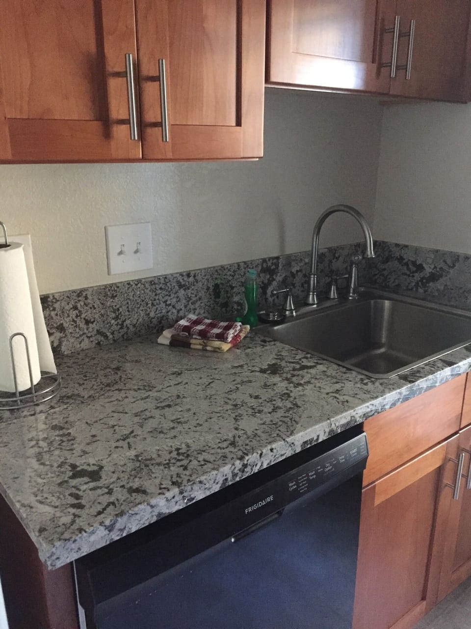 Dishwasher, granite countertops, sink, quality cabinets.