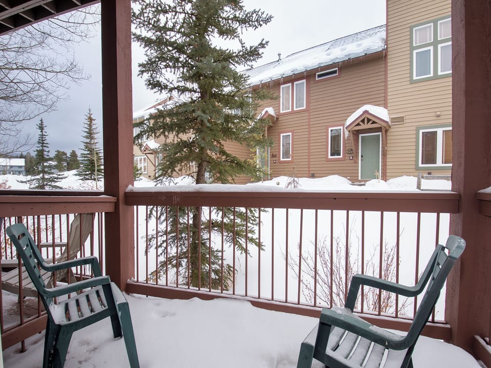 Step onto your private balcony for crisp winter air and peaceful mountain views, with cozy chairs perfect for morning coffee.