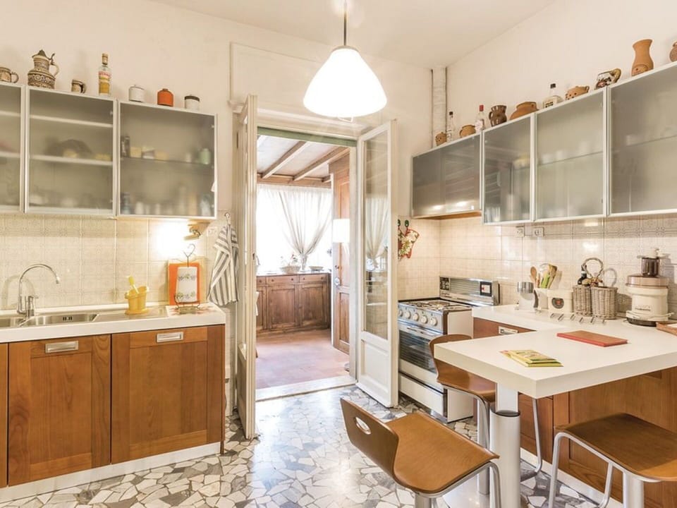 Room, Property, Furniture, Countertop, Interior Design, Kitchen, Cabinetry, Building, Yellow, Floor