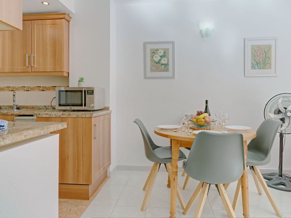 Furniture, Cabinetry, Table, Countertop, Building, Chair, Wood, Lighting, Interior Design, Kitchen Appliance