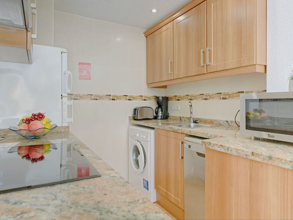 Countertop, Cabinetry, Property, Kitchen, Kitchen Appliance, Kitchen Stove, Wood, Lighting, Interior Design, Flooring