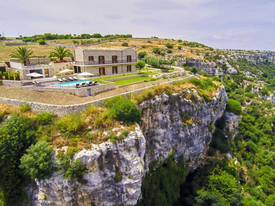 Natural Landscape, Cliff, House, Terrain, Building, Rock, Coast, Tourism, Rural Area, Architecture