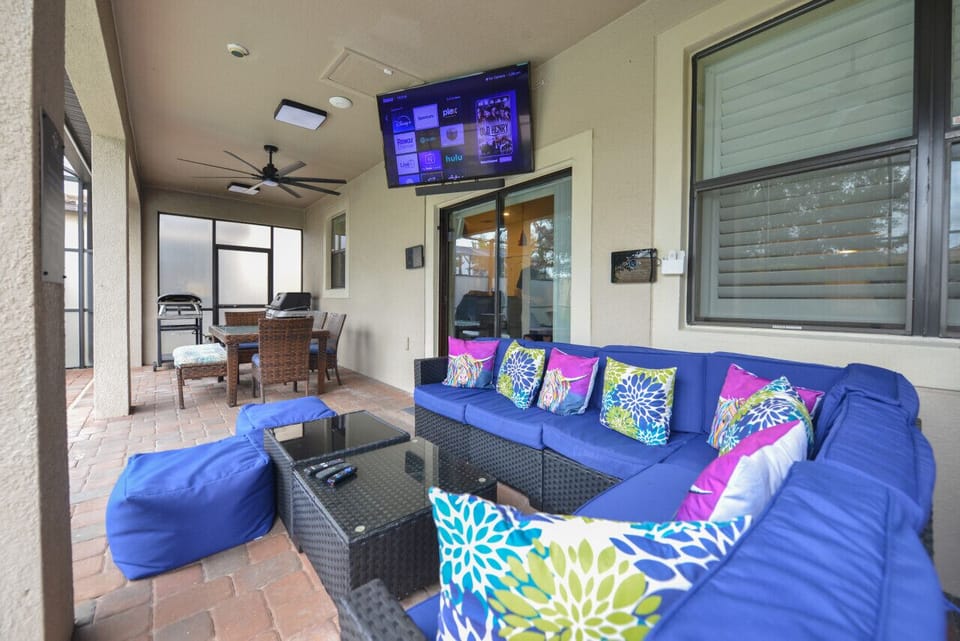 Patio Seating and Dining area with 65in TV and High Powered Fans