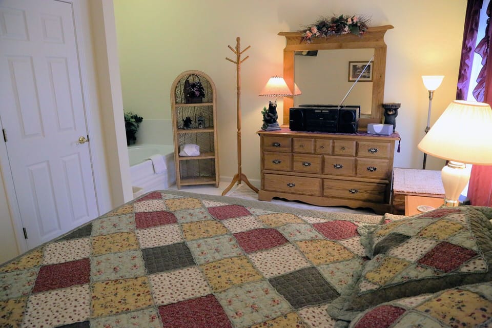 The Bedroom with King Bed, Flat ScreenTV, Radio/CD/Tape Combo & Jacuzzi Tub