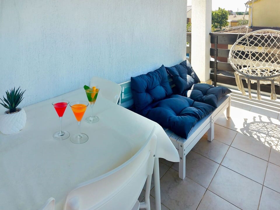 Table, Couch, Furniture, Azure, Interior Design, Living Room, Studio Couch, Outdoor Furniture, Building, Comfort