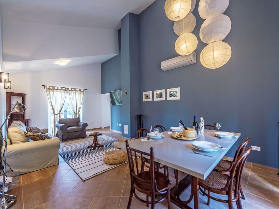 Furniture, Interior Design, Flooring, Wall, Ceiling, Floor, Light Fixture, Room, Lighting, Chair