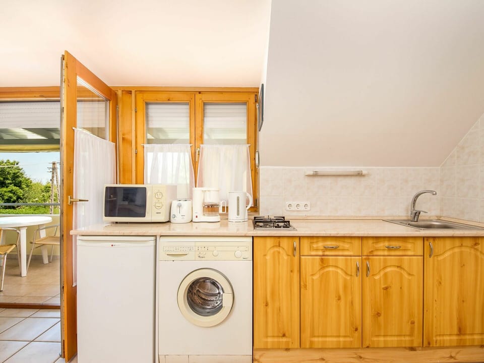 Cabinetry, Furniture, Property, Building, Countertop, Sink, Bathroom Cabinet, Plumbing Fixture, Houseplant, Tap