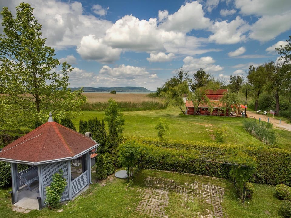Cloud, Sky, Plant, Window, Building, Tree, Natural Landscape, Land Lot, House, Grass