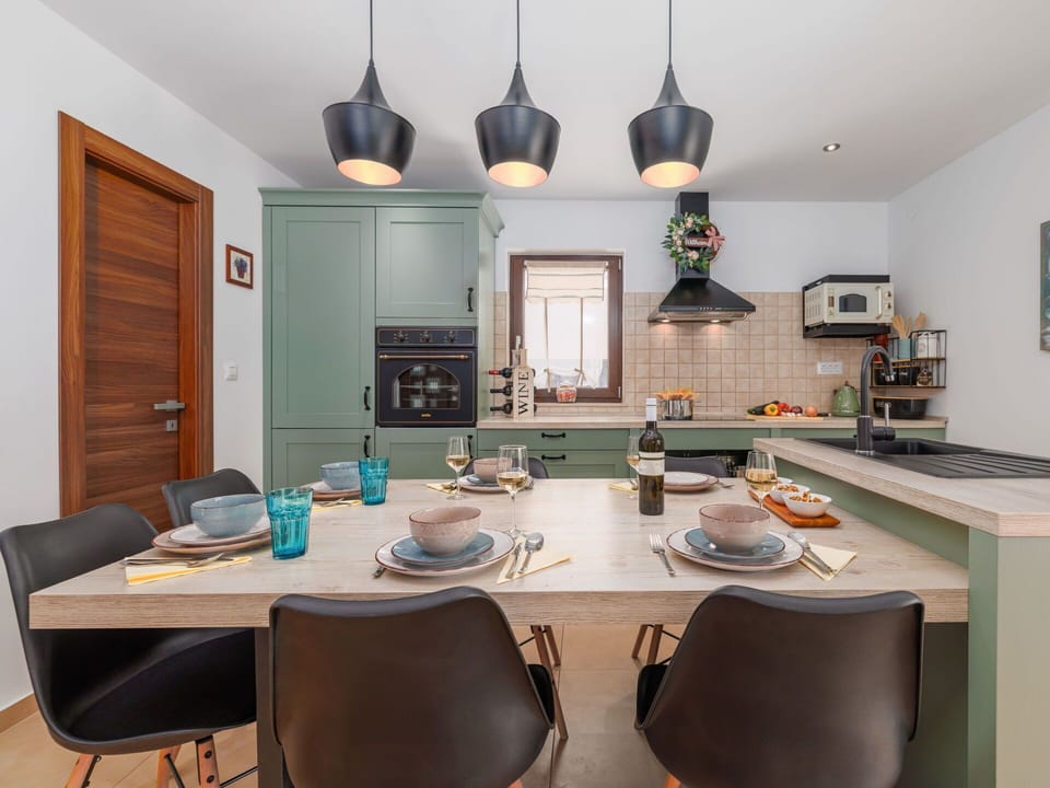 Furniture, Interior Design, Kitchen, Light Fixture, Wood, Ceiling, Flooring, Countertop, Chair, Room