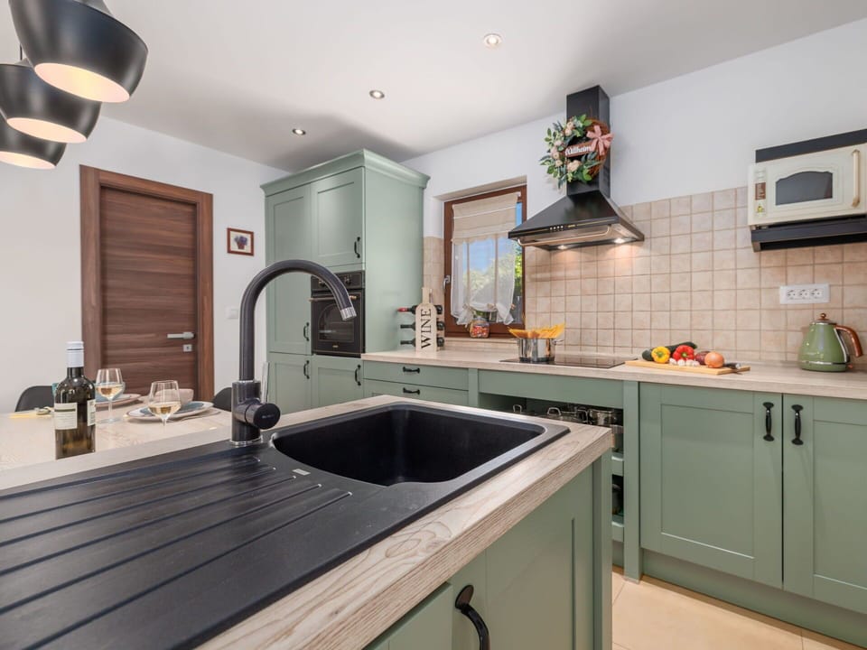 Kitchen, Countertop, Kitchen Appliance, Cabinetry, Furniture, Interior Design, Major Appliance, Flooring, Wood, Light Fixture