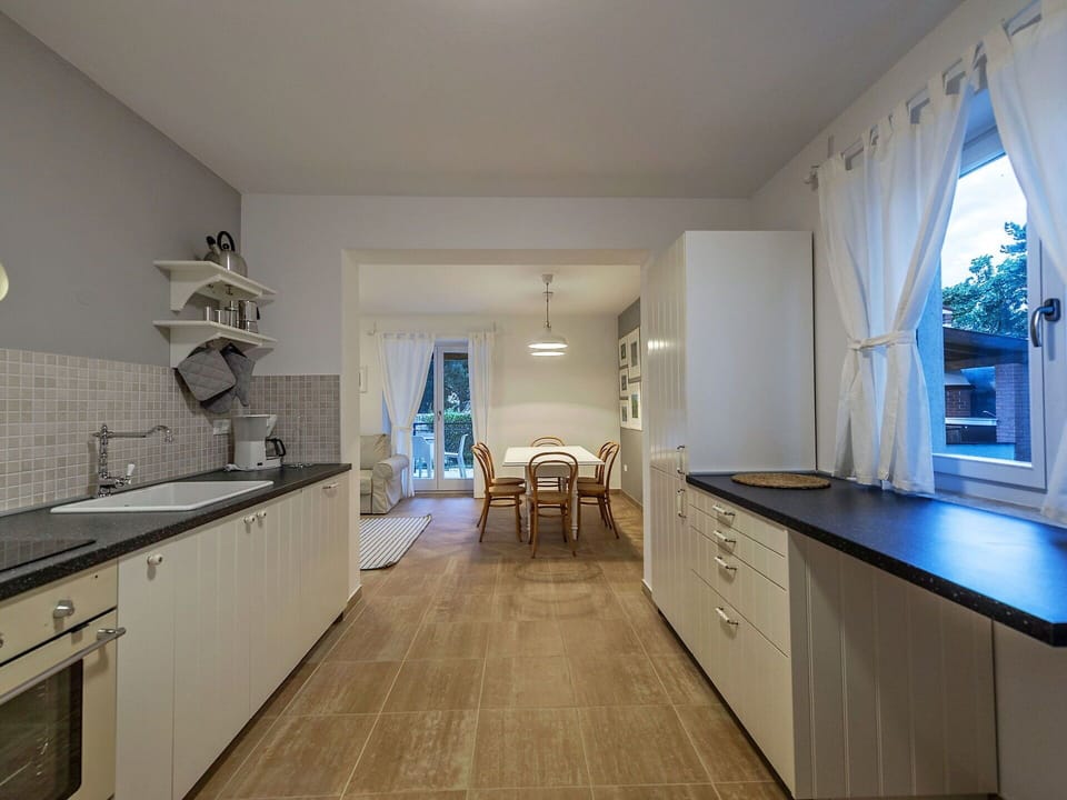 Flooring, Interior Design, Floor, Kitchen, Wood, Ceiling, Countertop, Furniture, Wood Flooring, Cabinetry