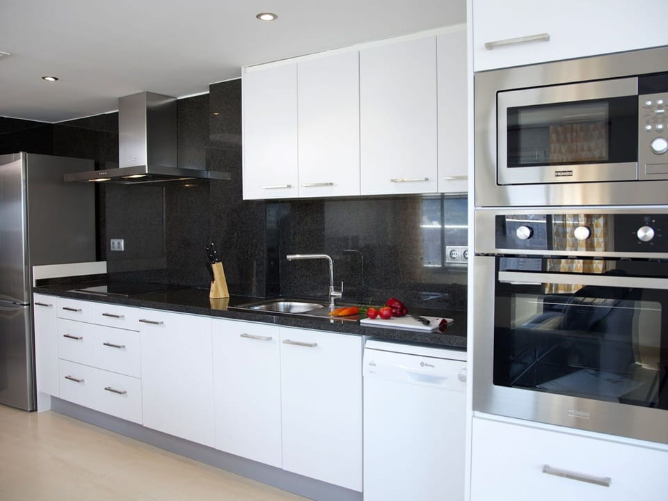 Countertop, Cabinetry, Kitchen, Room, Furniture, Property, Interior Design, Microwave Oven, Major Appliance, Home Appliance